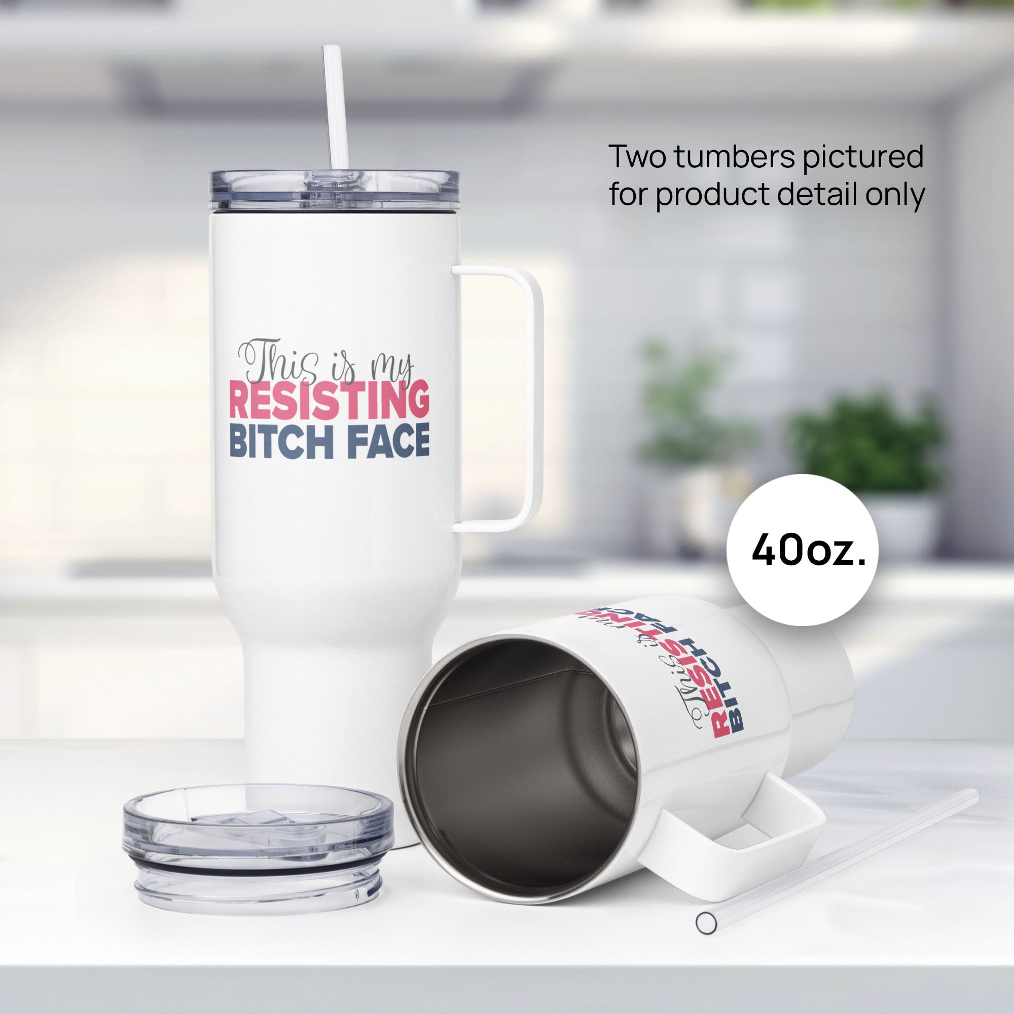 Two 40 ounce white insulated travel tumblers with the phrase “This Is My Resisting Bitch Face” printed in script and bold text, resting on a kitchen counter, showing detail.