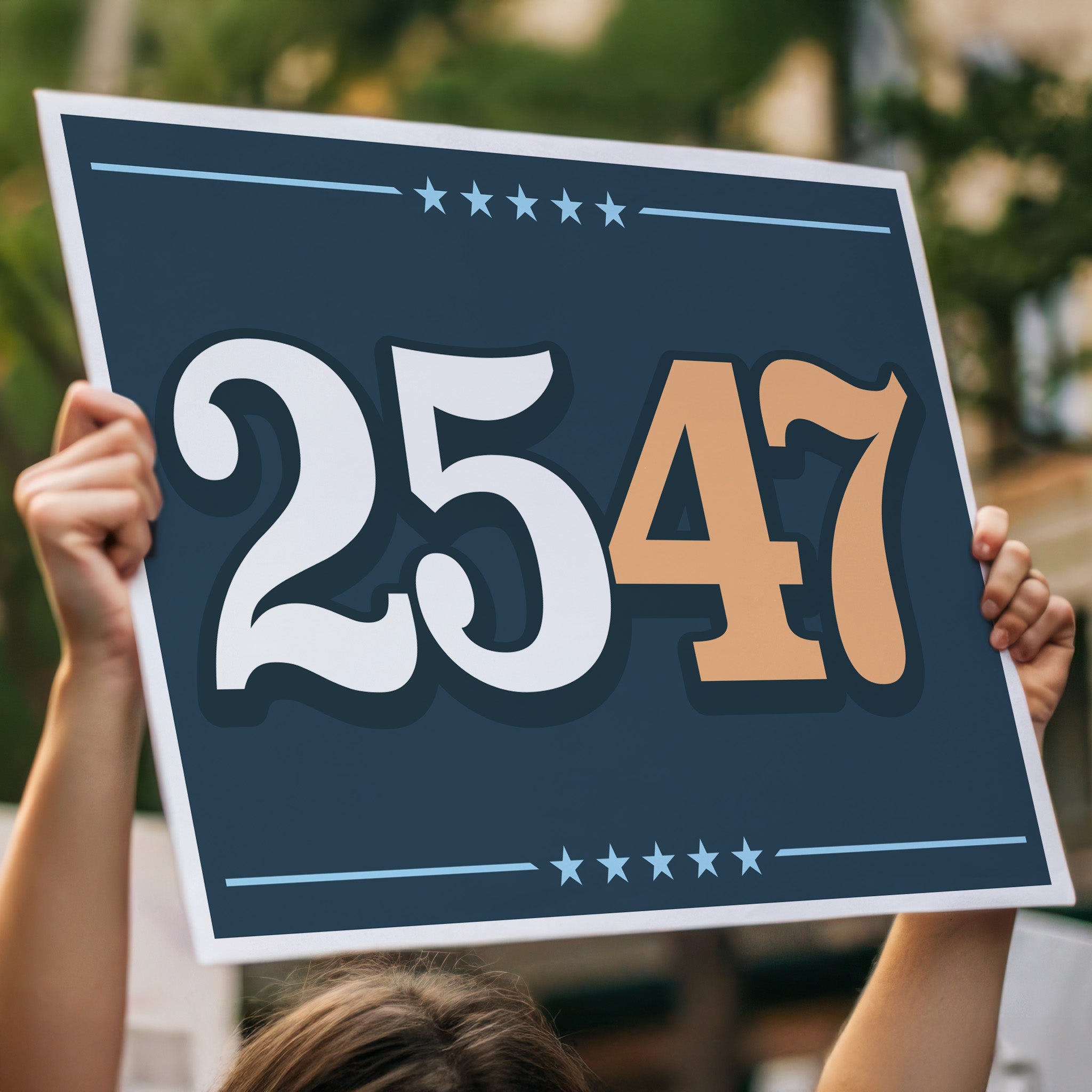 Protest sign held high above a crowd, with bold numbers “25” in white and “47” in orange on a navy background, symbolizing invoking the 25th Amendment to remove Trump from office.
