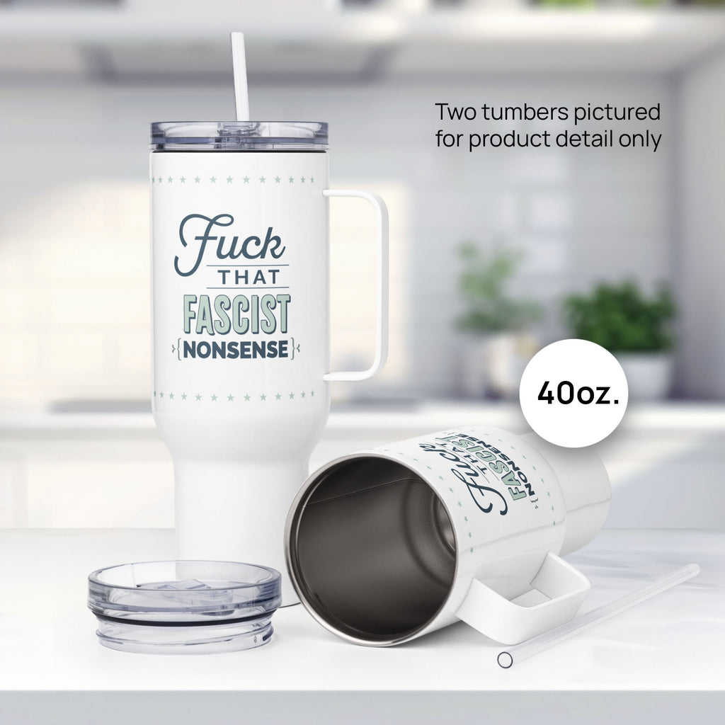 Two 40 ounce white insulated travel tumblers with handle featuring the bold quote “Fuck That Fascist Nonsense” in blue and mint green text, on a counter in a kitchen, showing mug detail.