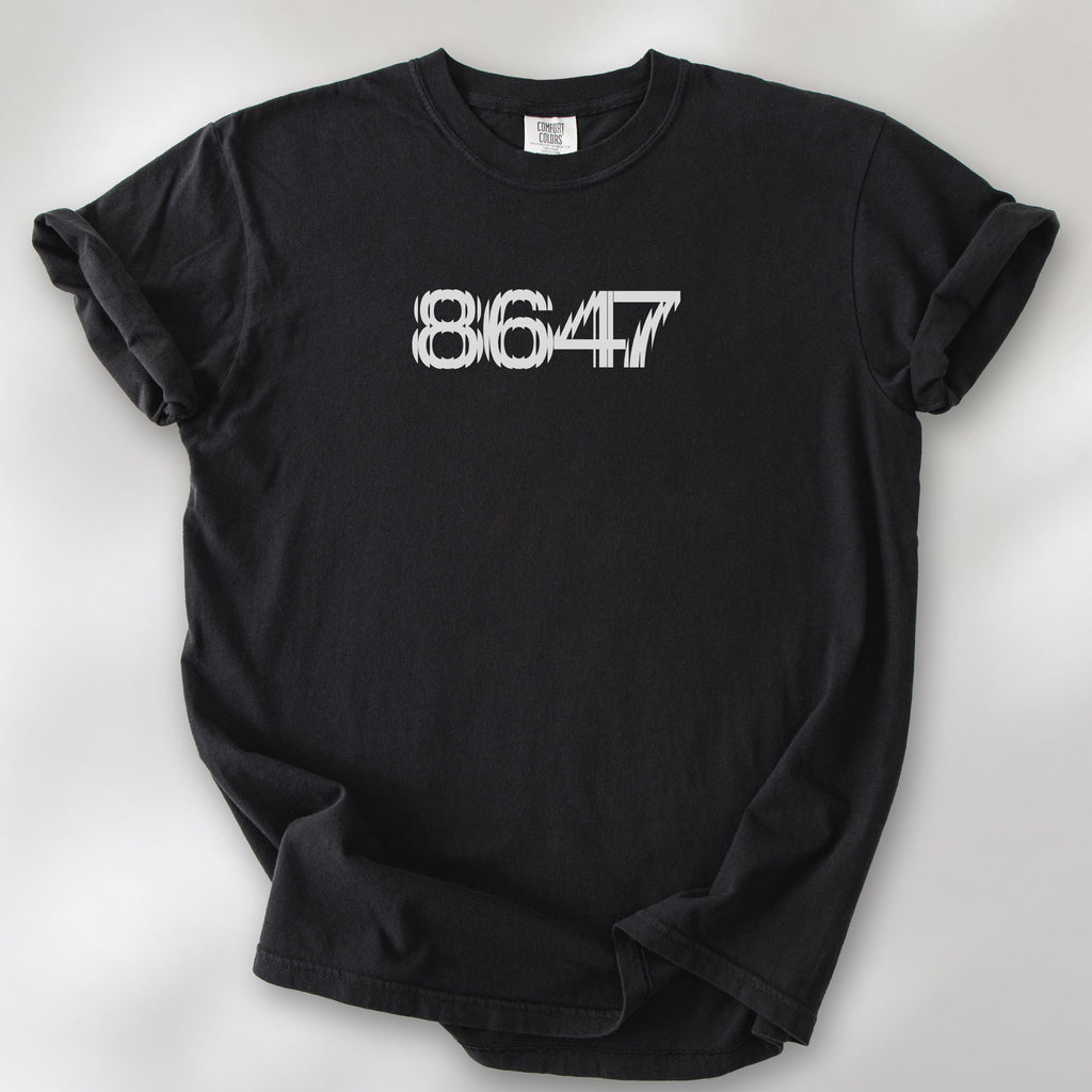 Black unisex t-shirt featuring the number “8647” in bold, clean typography with glass block effect, referencing Trump impeachment.