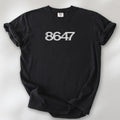 Black unisex t-shirt featuring the number “8647” in bold, clean typography with glass block effect, referencing Trump impeachment.