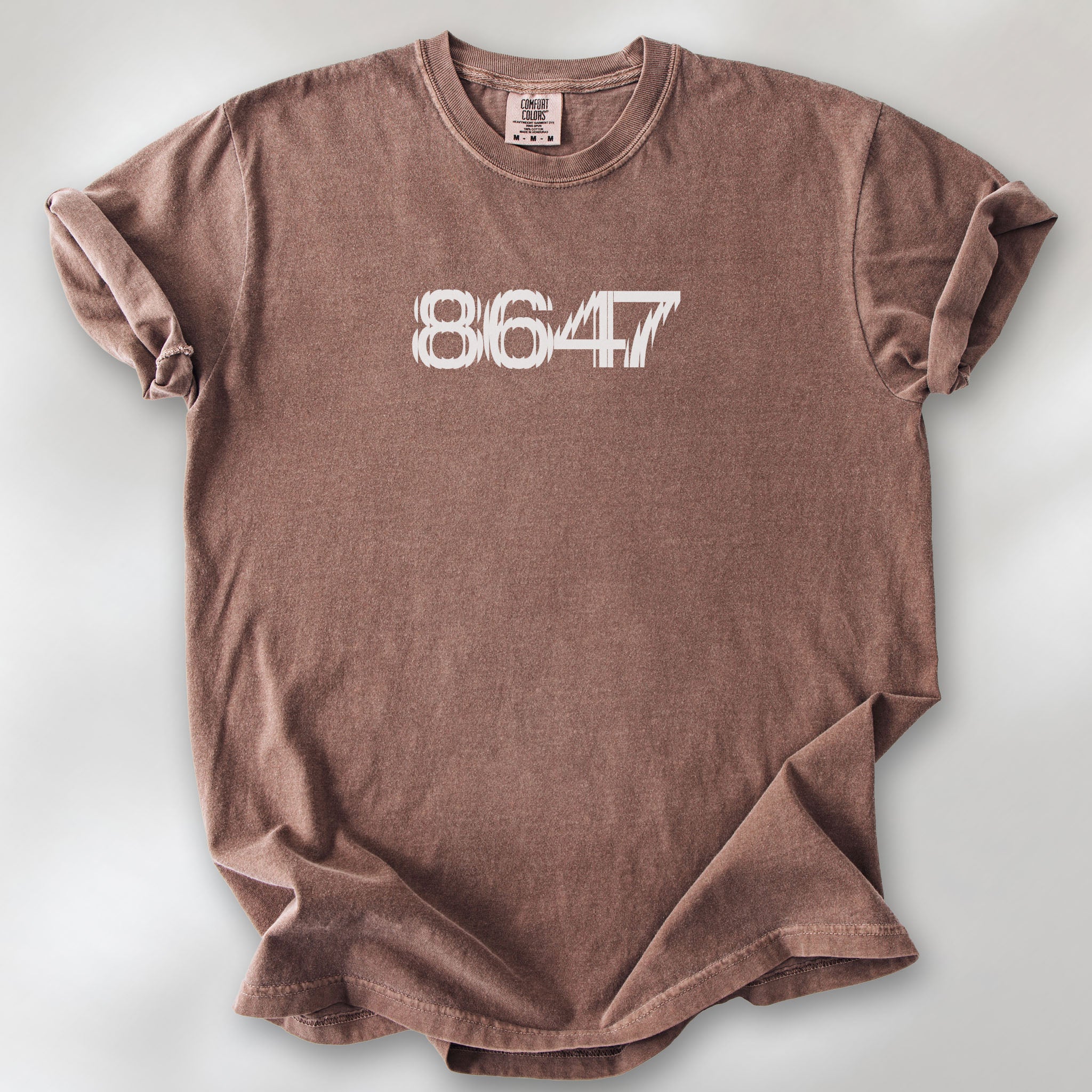 Espresso t-shirt featuring the number “8647” in bold, clean typography with glass block effect.