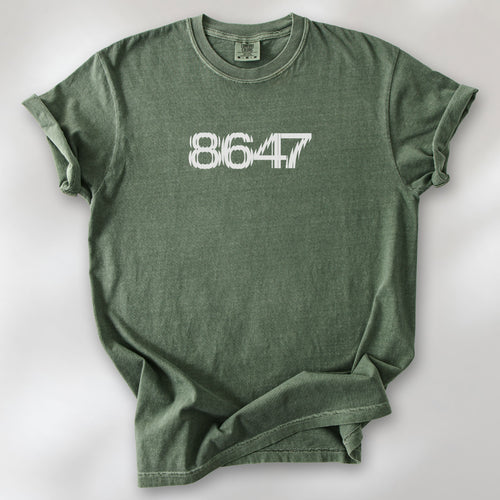 Moss t-shirt featuring the number “8647” in bold, clean typography with glass block effect.
