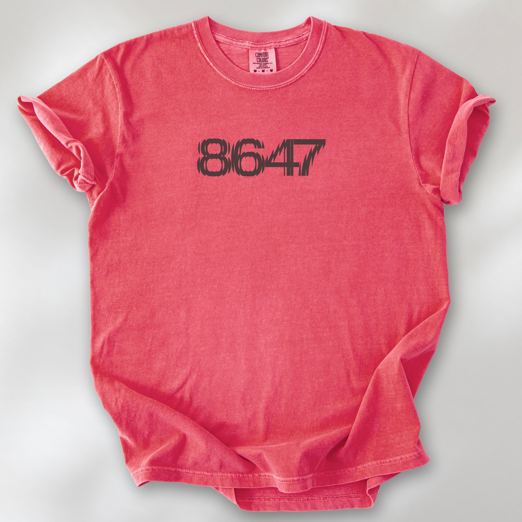 Watermelon unisex t-shirt featuring the number “8647” in bold, clean typography with glass block effect, referencing Trump impeachment.