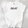 White unisex t-shirt featuring the number “8647” in bold, clean typography with glass block effect, referencing Trump impeachment.