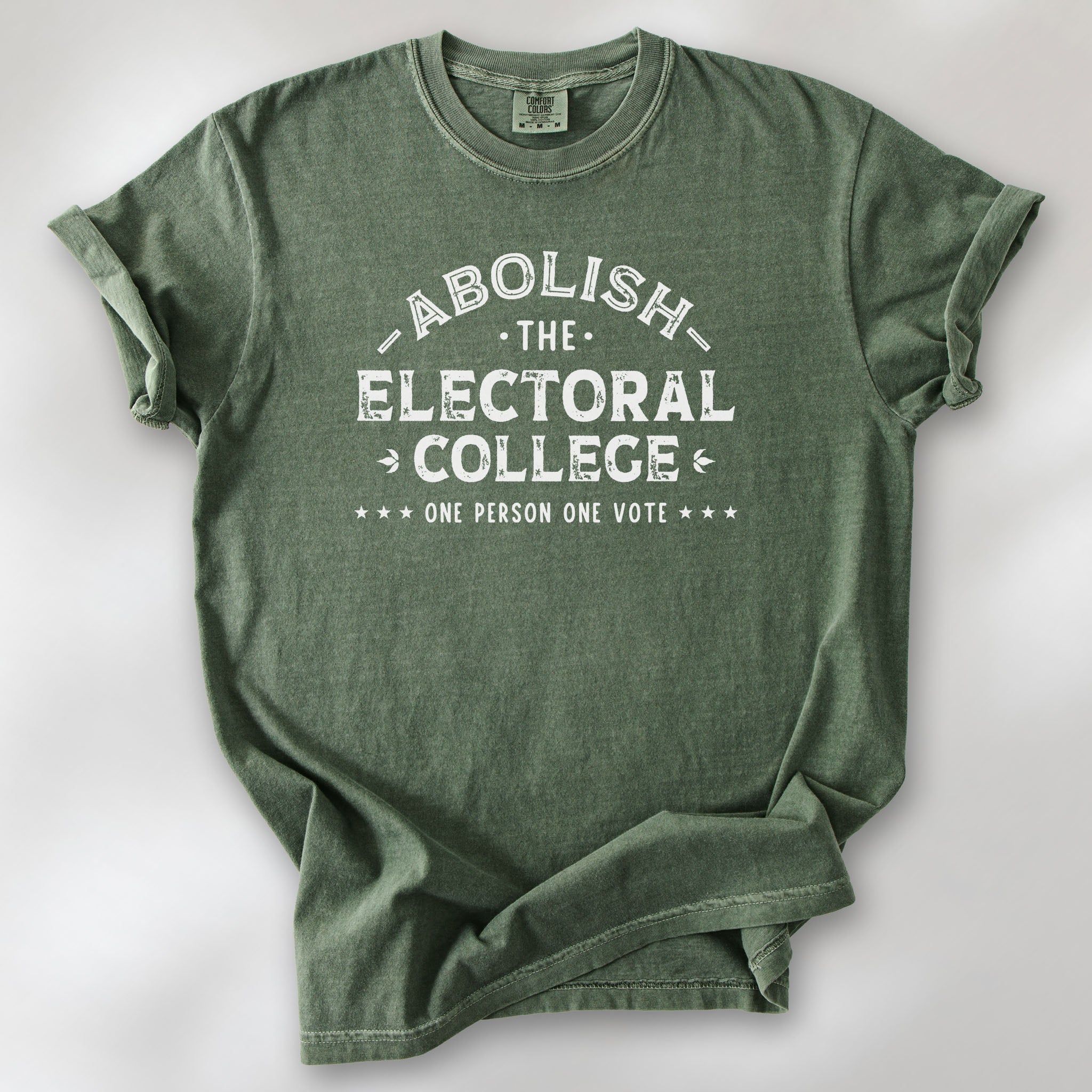 Moss t-shirt with distressed text reading “Abolish the Electoral College One Person One Vote” in vintage style design