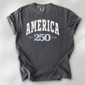 Pepper t-shirt with bold varsity text reading “America 250 — Est. 1776” in varsity style design. 