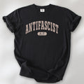 Black Comfort Colors t-shirt with varsity collegiate style text across the front that reads "Antifascist AF."