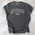 Pepper Comfort Colors t-shirt with varsity collegiate style text across the front that reads "Antifascist AF."