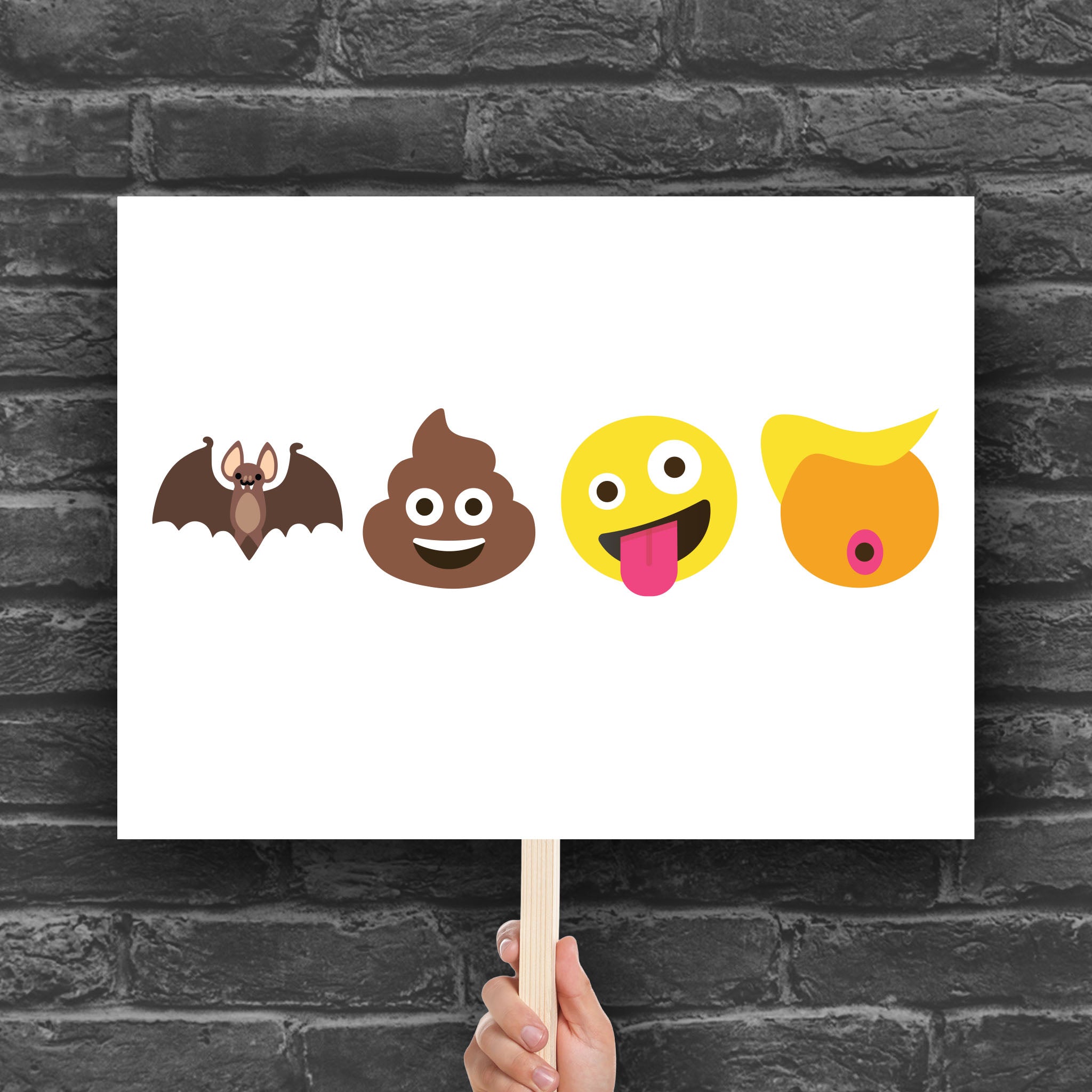 Downloadable, printable protest sign featuring four emojis: a bat, poop, crazy face, and Trump-like orange face with yellow hair, spelling out “batshit crazy Trump” in bold visual satire.