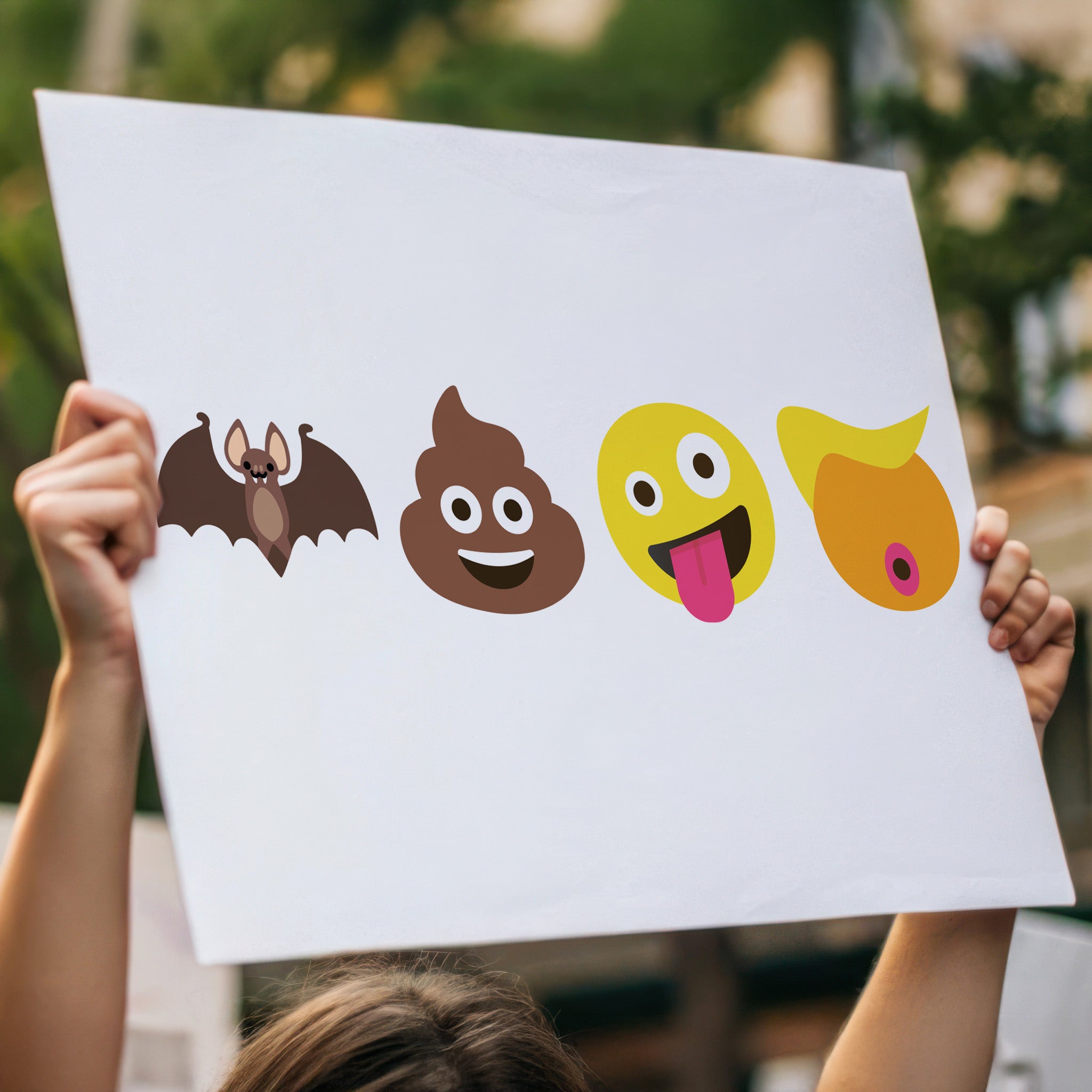 Downloadable, printable protest sign featuring four emojis: a bat, poop, crazy face, and Trump-like orange face with yellow hair, spelling out “batshit crazy Trump” in bold visual satire, being held up high in a crowd.