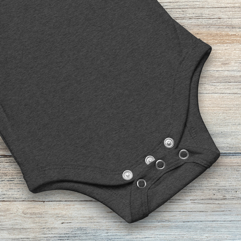 Closeup of snaps on dark heather grey baby short sleeve one piece.