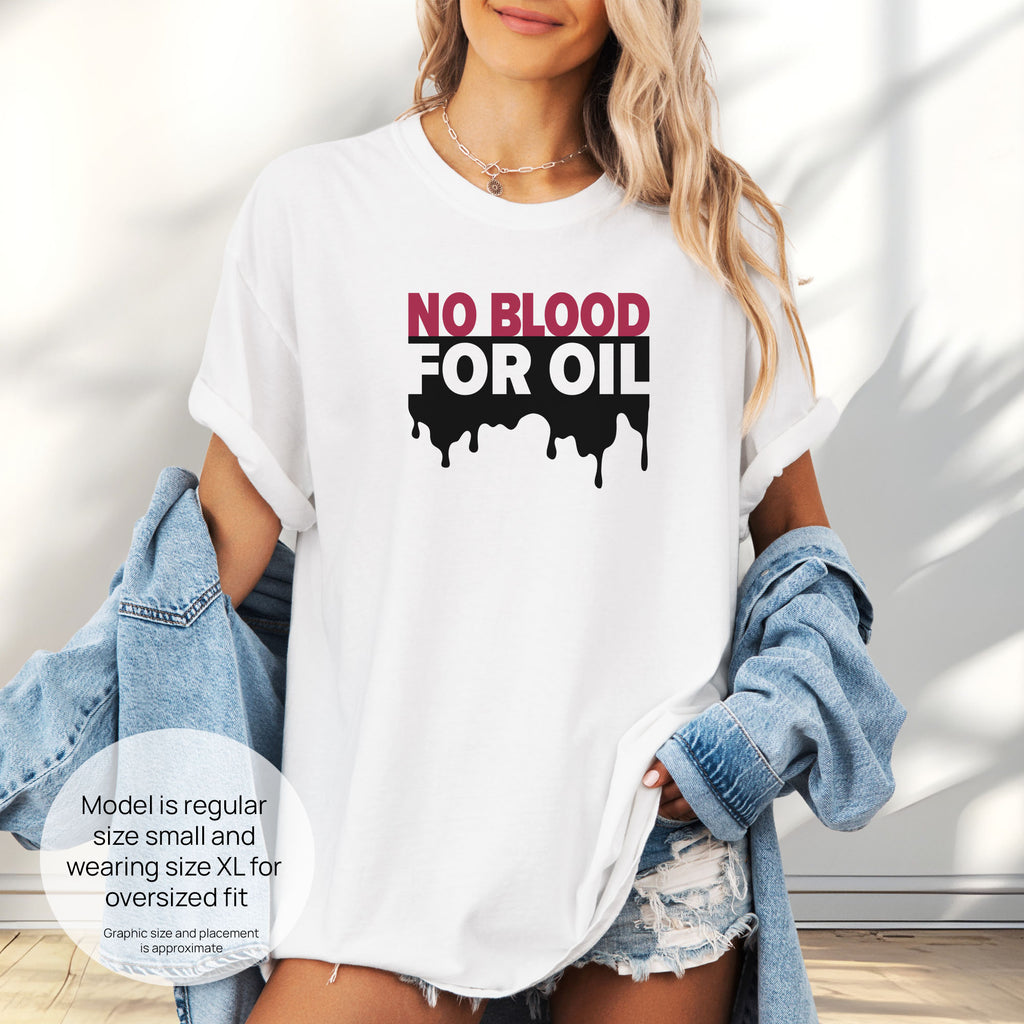 Female model wearing white protest t-shirt with bold text reading “No Blood for Oil” and dripping oil graphic, anti-war political shirt. Includes size and fit information for the model who is regular size small, and wearing a size XL shirt for an oversized fit.
