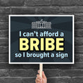 Downloadable, printable protest sign with a dark blue background and blue and yellow text that reads "I can't afford a bribe so I brought a sign" with an illustration of the White House, a condemnation of Trump's corruption.