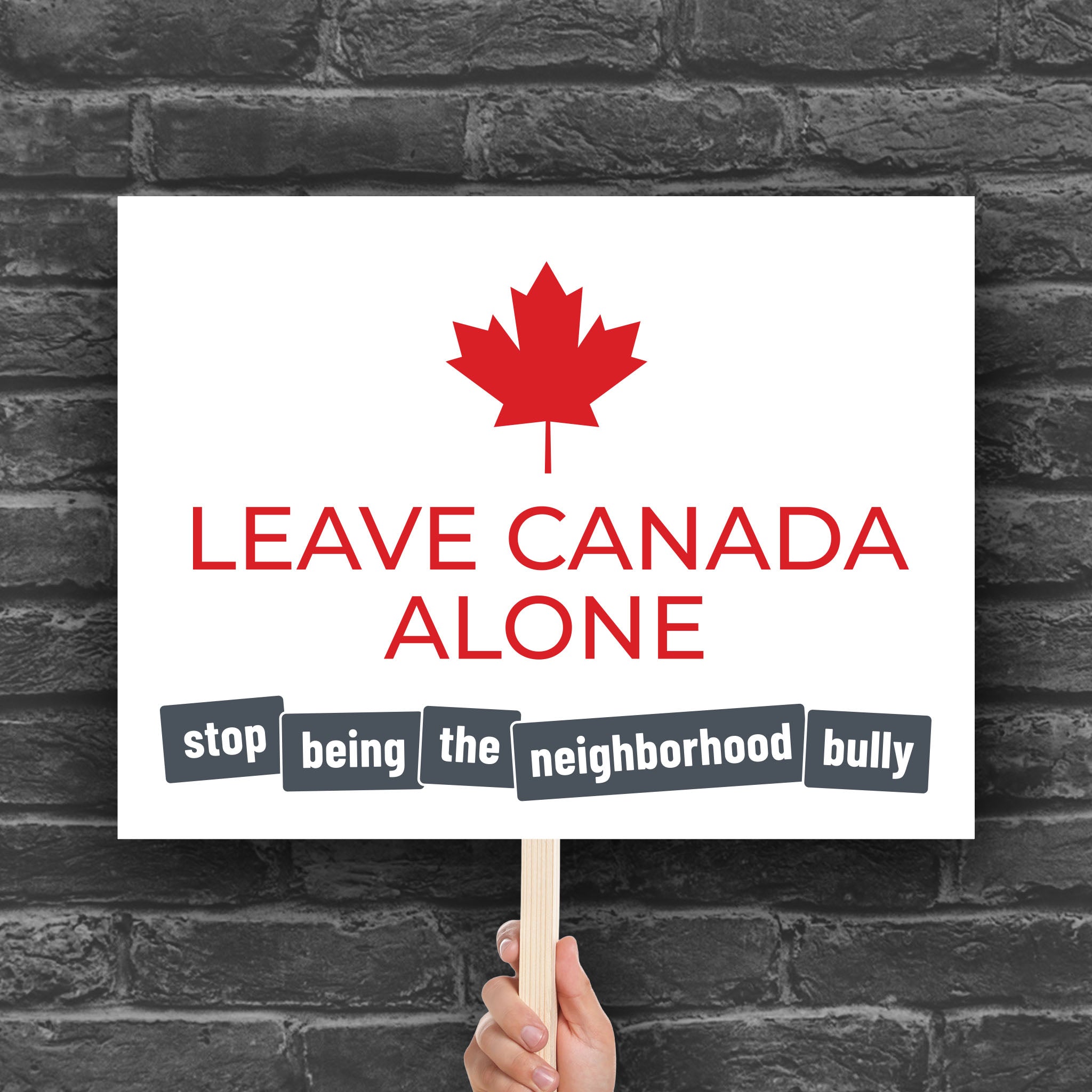 Downloadable, printable protest sign with strong red text: "Leave Canada Along" and smaller grey text: "Stop being the neighborhood bully" to directly call out of Trump foreign and tariff policy.