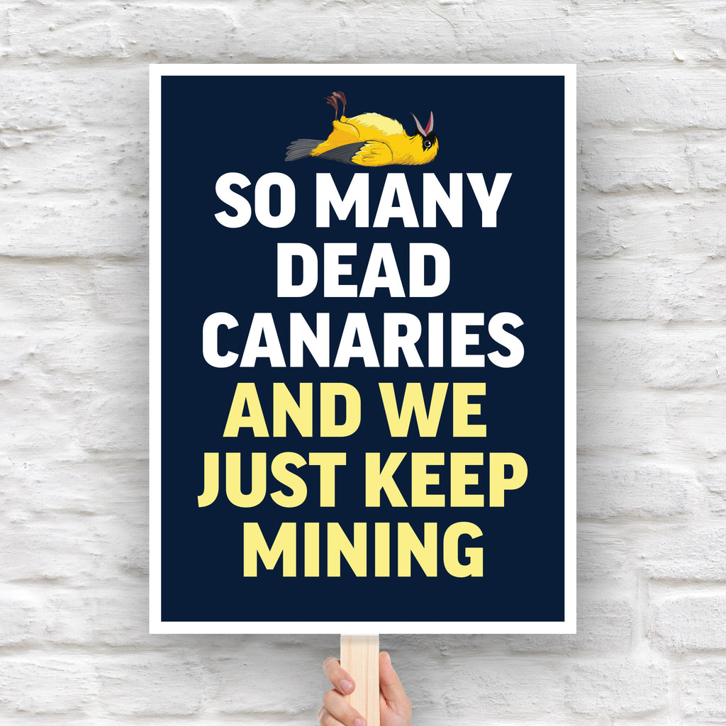 Anti-Trump protest sign with a dead canary illustration and bold text reading “So Many Dead Canaries And We Just Keep Mining,” symbolizing ignored fascist warning signs.