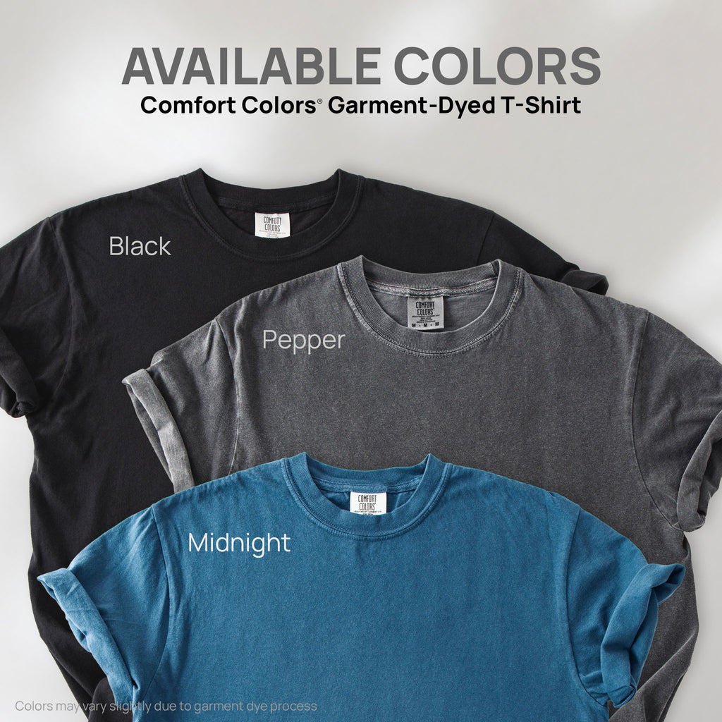 Three shirts showing the available colors for this Comfort Colors Garment-Dyed T-Shirt: pepper, black, and midnight.
