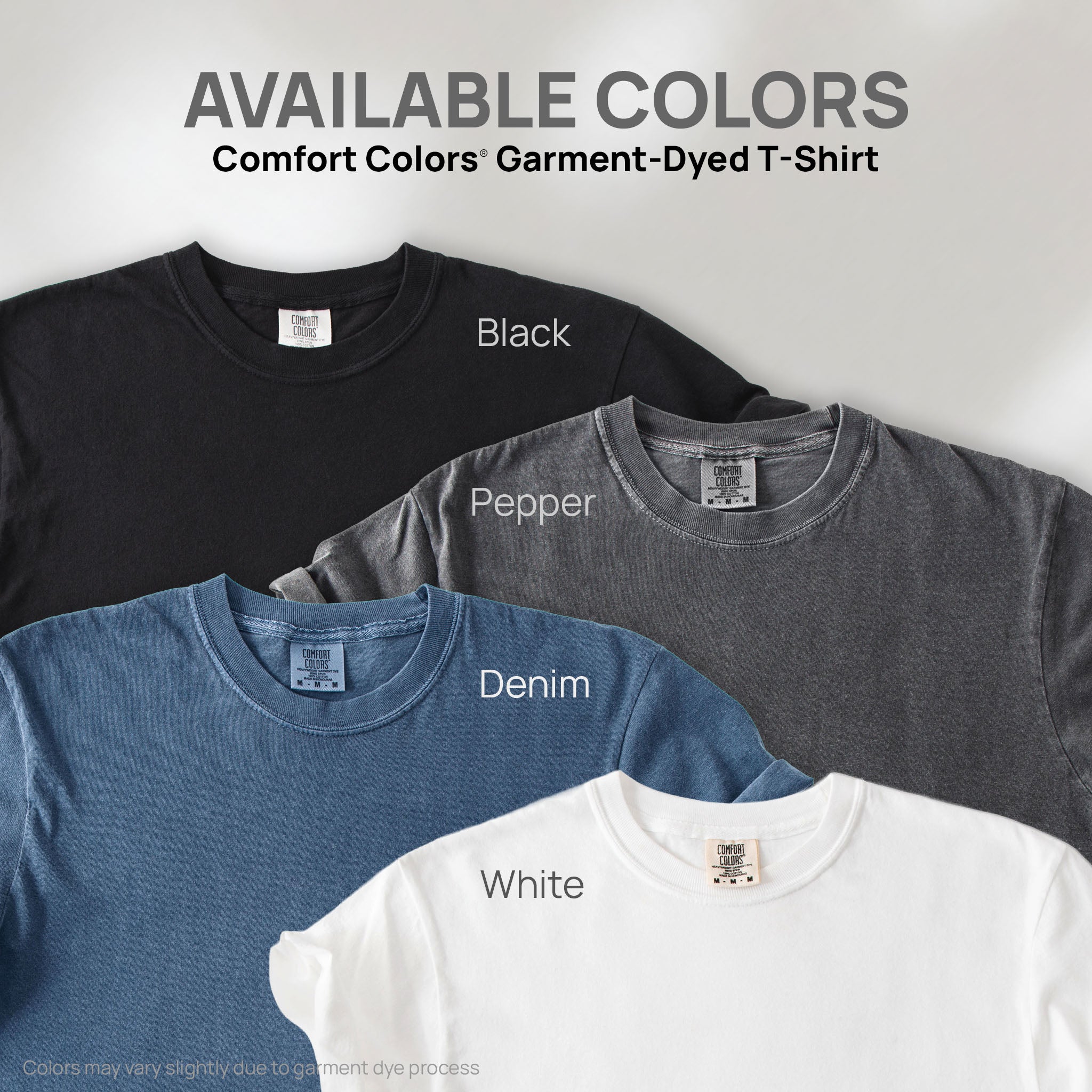 Four shirts showing the available colors for this Comfort Colors Garment-Dyed T-Shirt: black, pepper, denim, and white.
