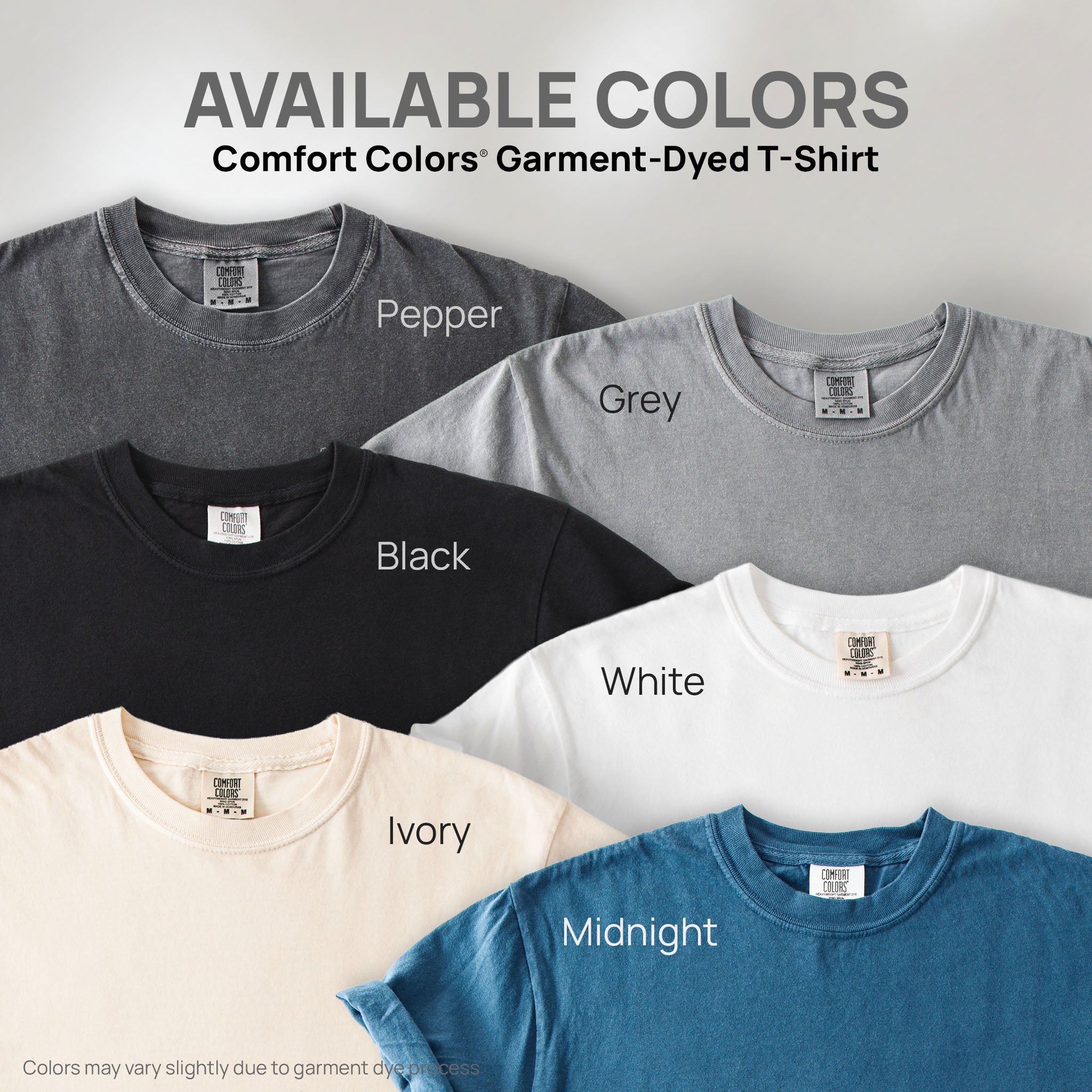 Six shirts showing the available colors for this Comfort Colors Garment-Dyed T-Shirt: pepper, grey, black, white, ivory, and midnight.
