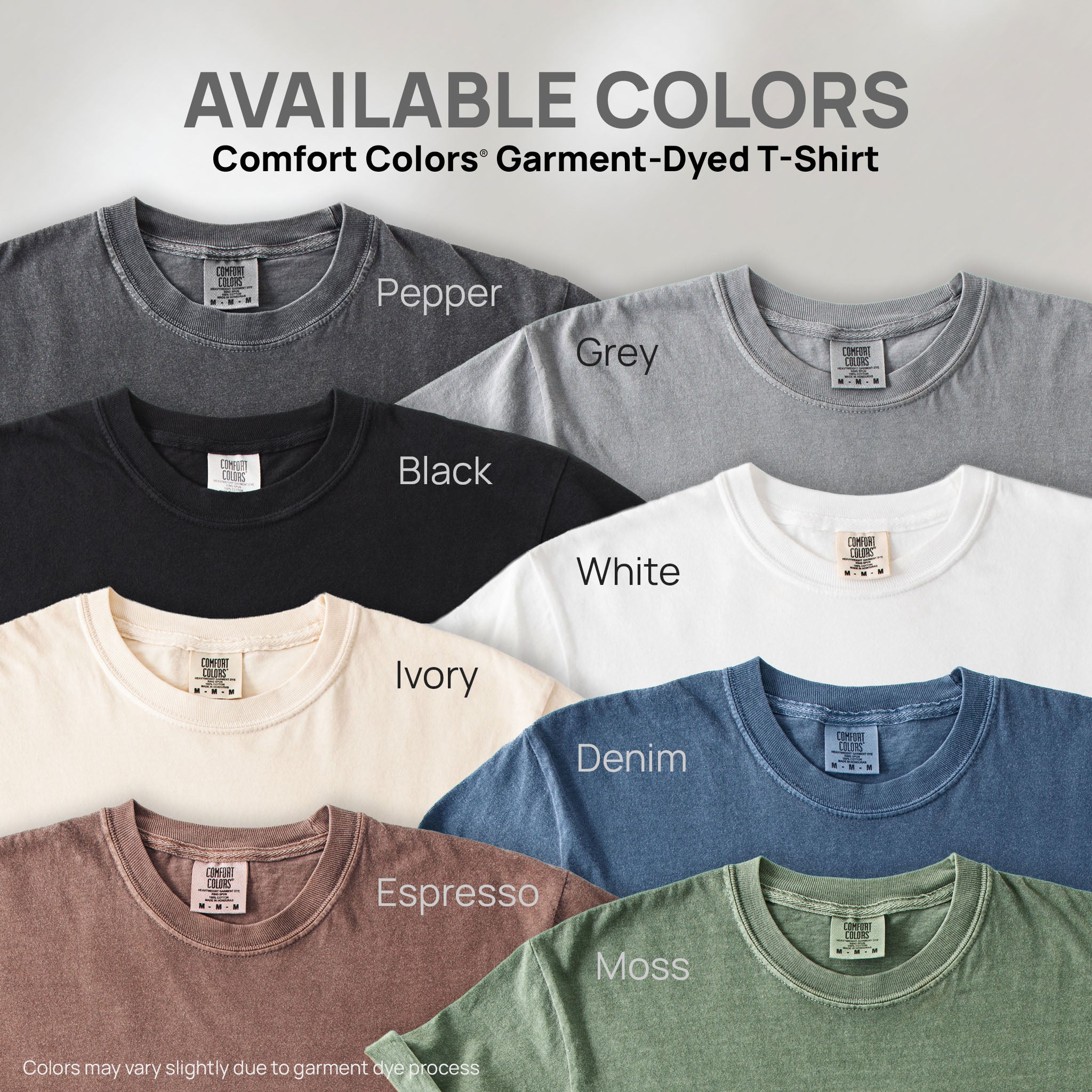 Eight shirts showing the available colors for this Comfort Colors Garment-Dyed T-Shirt: pepper, grey, black, white, ivory, denim, espresso, moss.
