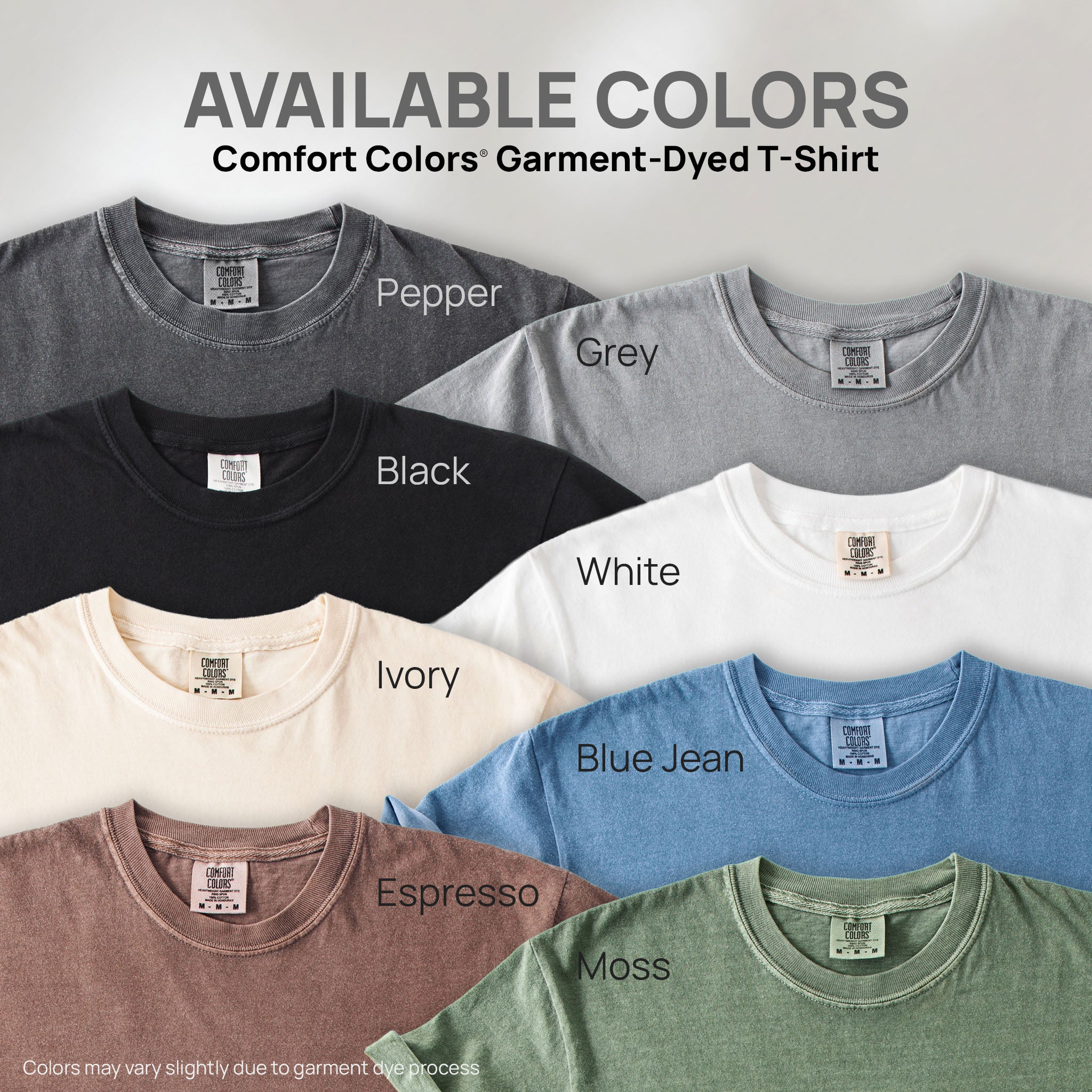 Eight shirts showing the available colors for this Comfort Colors Garment-Dyed T-Shirt: pepper, grey, black, white, ivory, blue jean, espresso, moss.