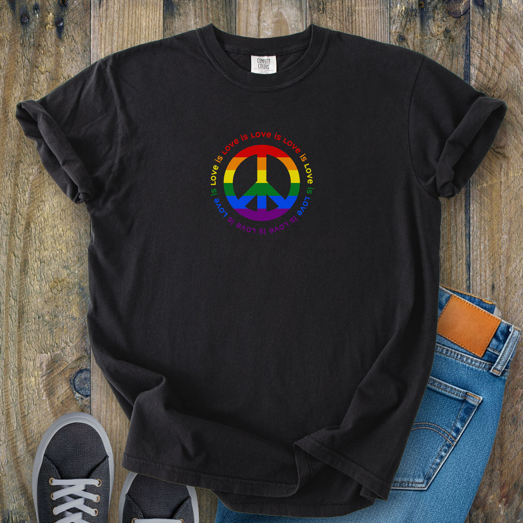 Black t-shirt with LGBTQ pride graphic — a peace sign in the LGBTQ flag colors, with the text "love is love" repeated in a circle around the peace sign.