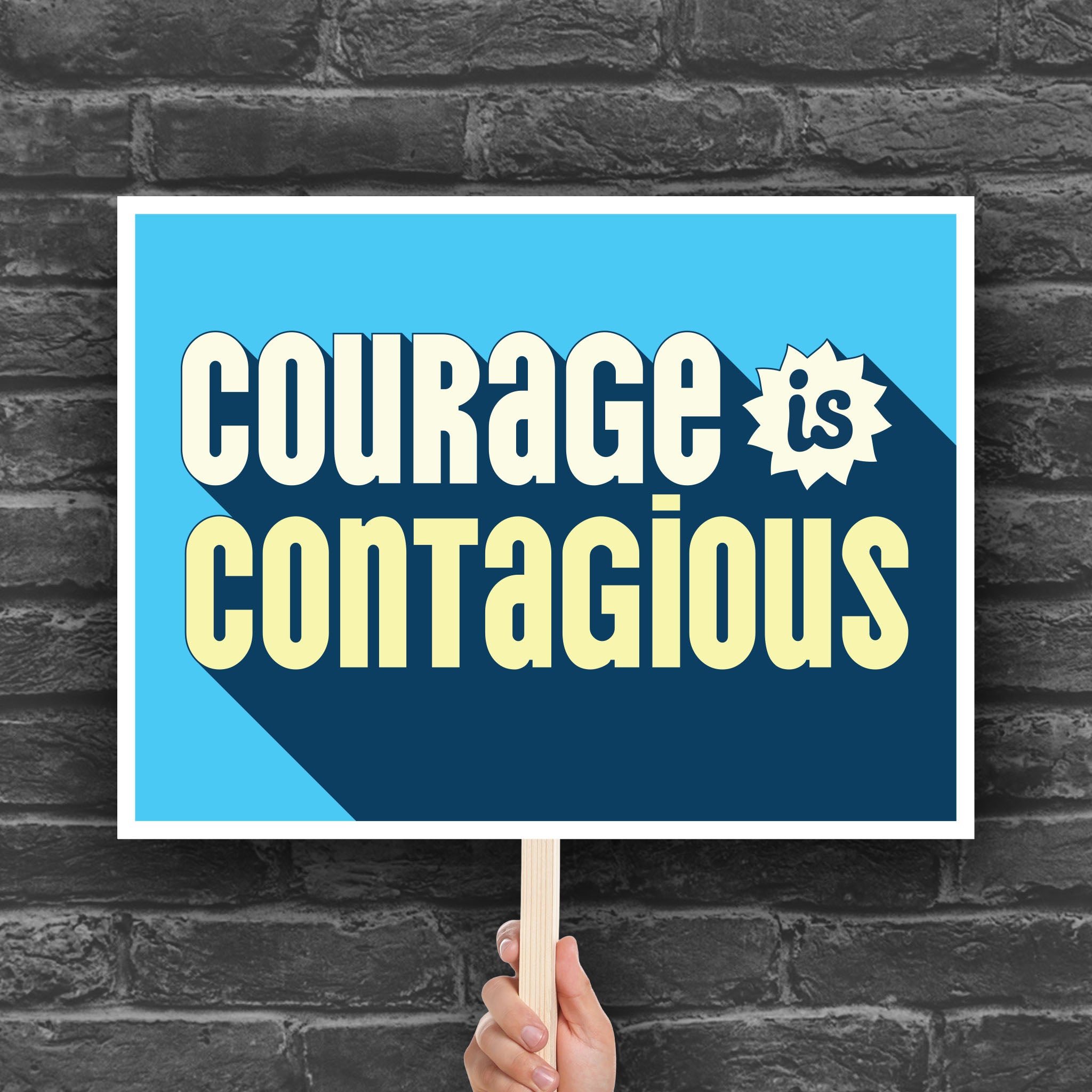 Downloadable, printable protest sign that reads: “Courage is contagious” in bold stylized yellow and blue text— a bold, empowering message for activism, civil rights rallies, and pro-democracy protests.