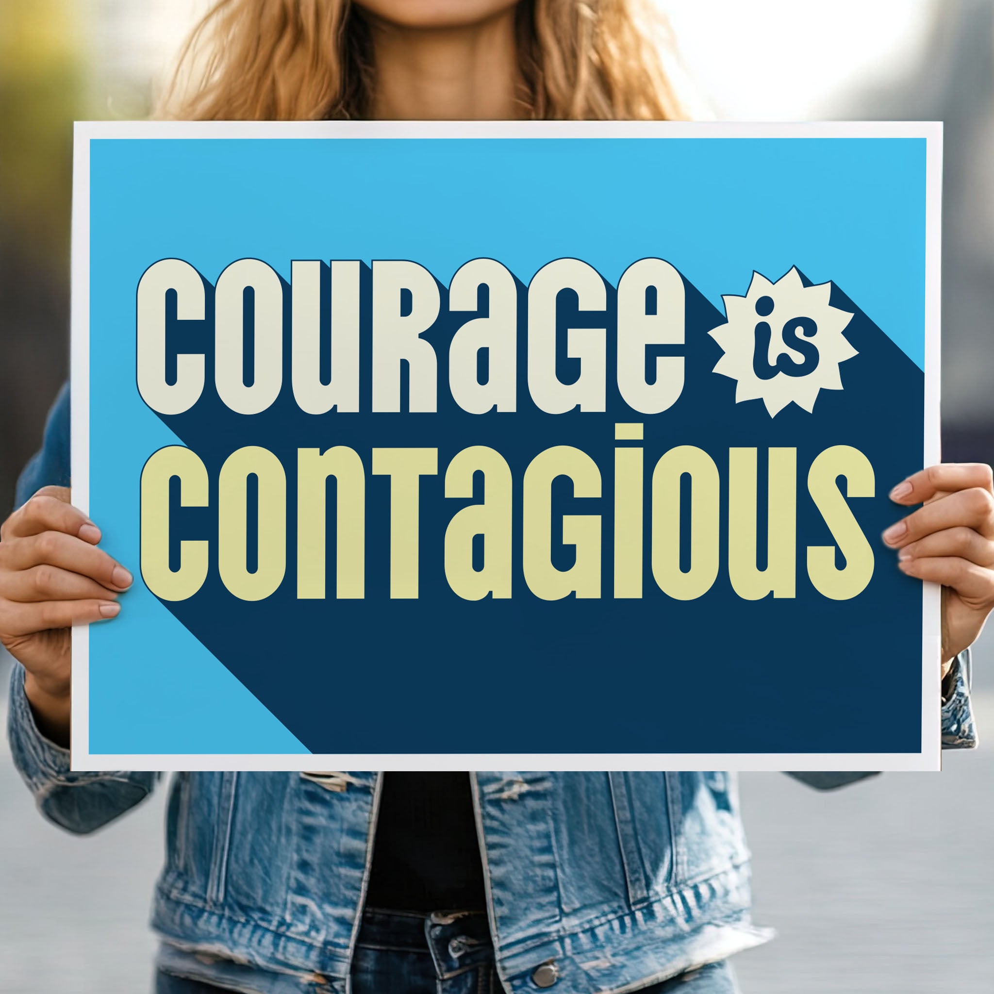 Person holding protest sign that reads: “Courage is contagious” in bold stylized yellow and blue text— a bold, empowering message for activism, civil rights rallies, and pro-democracy protests.
