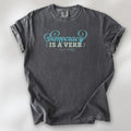 Pepper t-shirt with the phrase “Democracy Is a Verb” in decorative lettering.