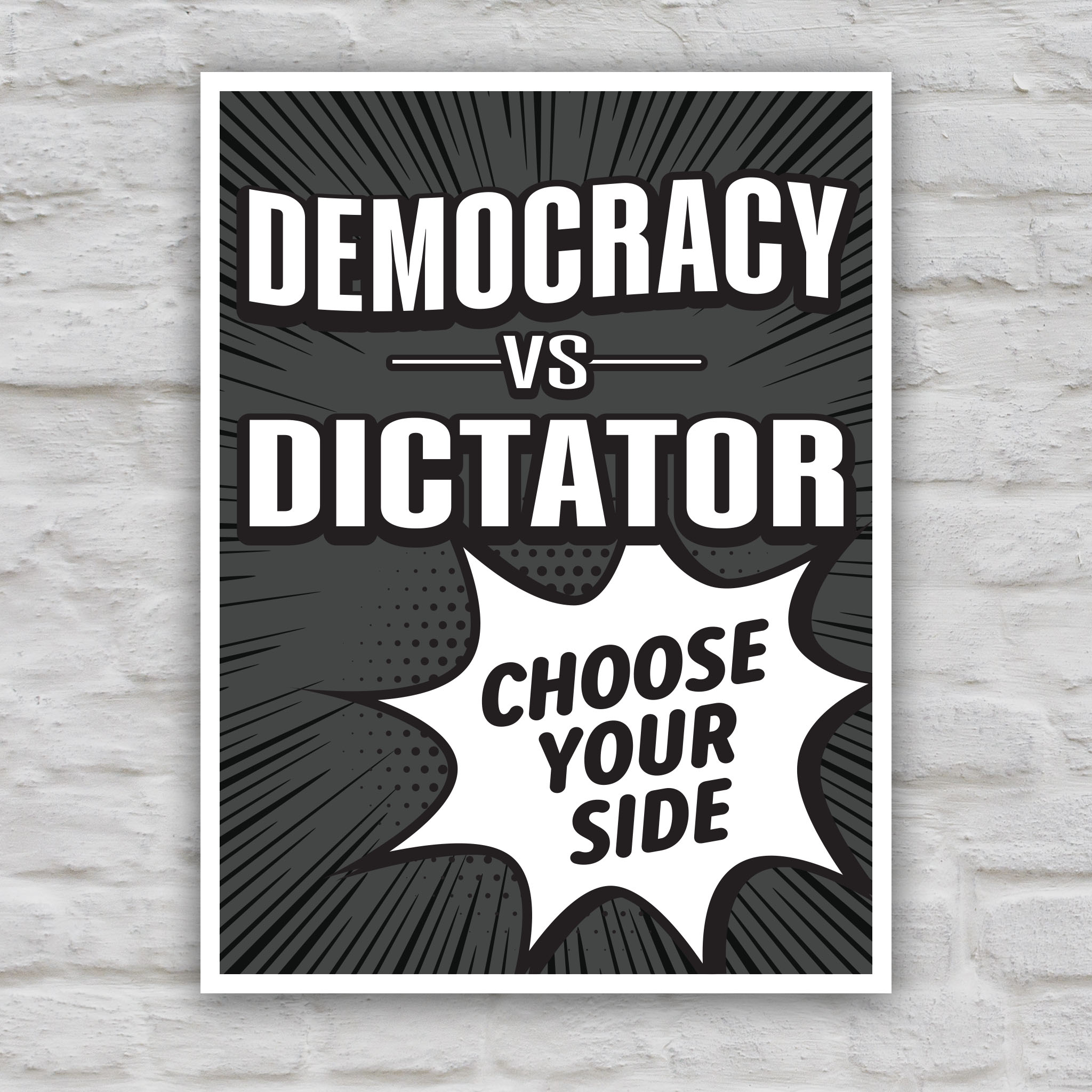 Black and white version of protest sign reading “Democracy vs Dictator – Choose Your Side” in bold comic-style lettering, a political protest poster against Trump.