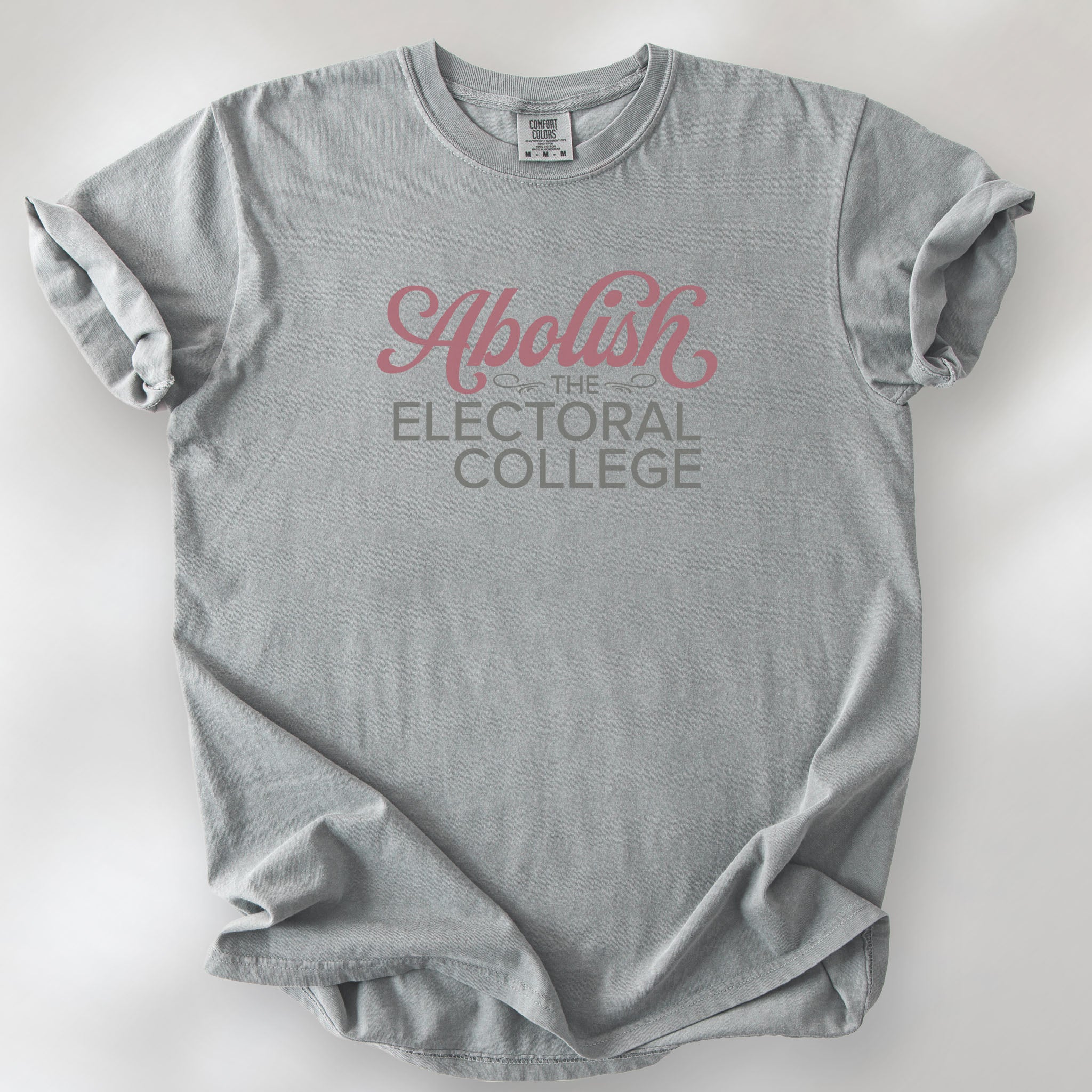 Granite t-shirt with stylized text reading “Abolish the Electoral College” in muted red and gray, minimalist pro-democracy design.