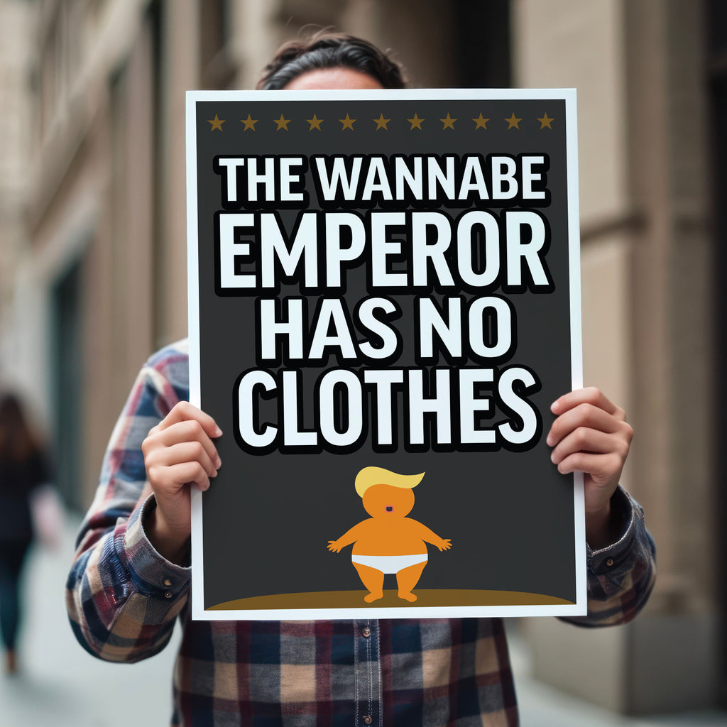 Person holding protest sign reading “The Wannabe Emperor Has No Clothes” with cartoon illustration of an orange baby with weird yellow hair dressed only in his underwear, looking much like Donald Trump.