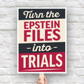 Protest sign reading “Turn the Epstein Files Into Trials” in bold retro lettering.
