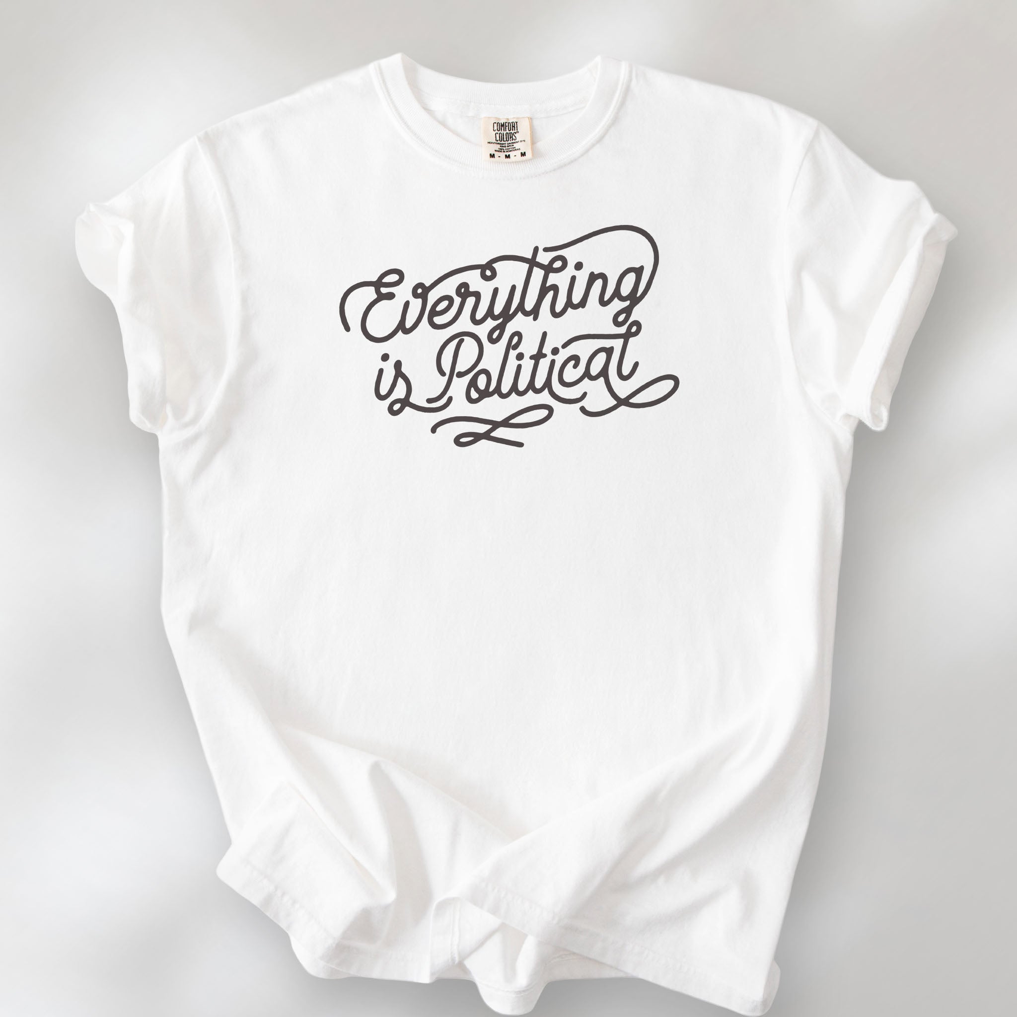 White shirt with minimalist script "everything is political" graphic.