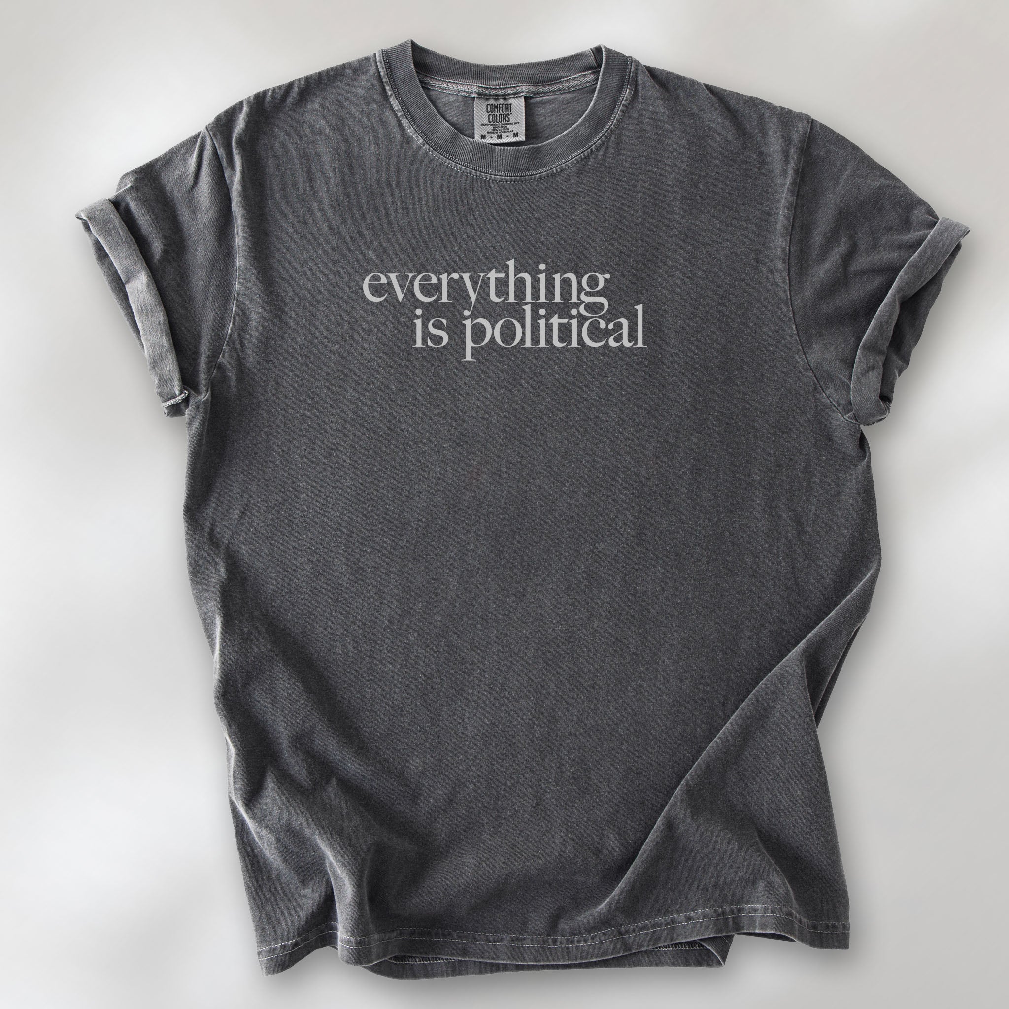 Pepper unisex t-shirt with minimalist serif gray text reading “everything is political."