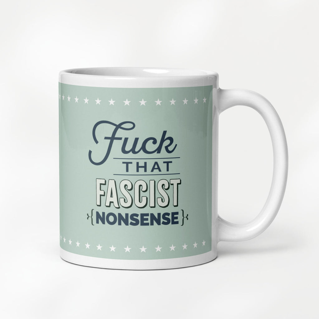 11 ounce ceramic mug with graphic on mint green background and navy styled text block that reads "fuck that fascist nonsense." 