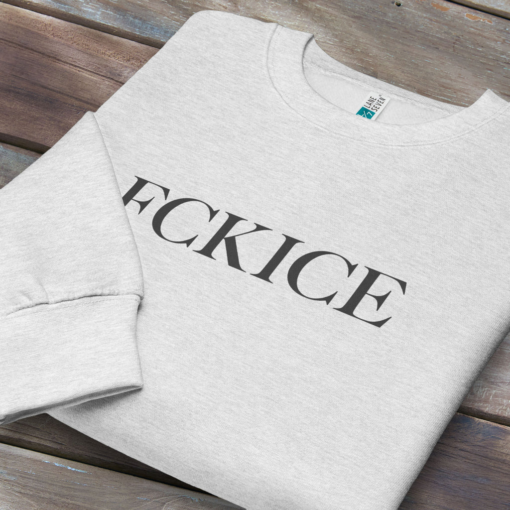 Folded grey sweatshirt with minimalist serif typography reading “FCK ICE,” an anti-ICE political message opposing Immigration and Customs Enforcement abuses and violence.