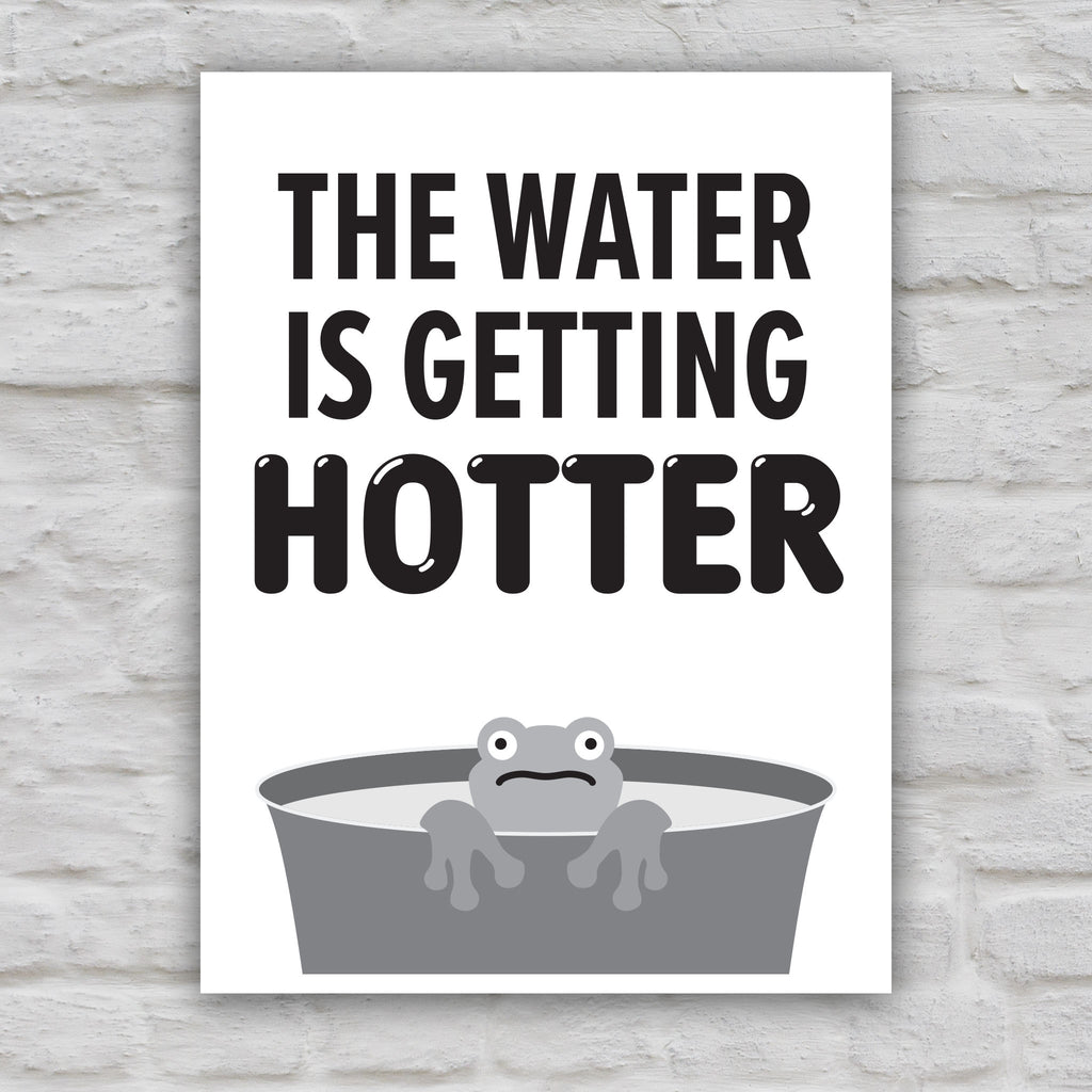 Black and white version of anti-trump protest sign with bold text that says "The water is getting hotter" above a cartoon illustration of a panicked frog in a pot of water.