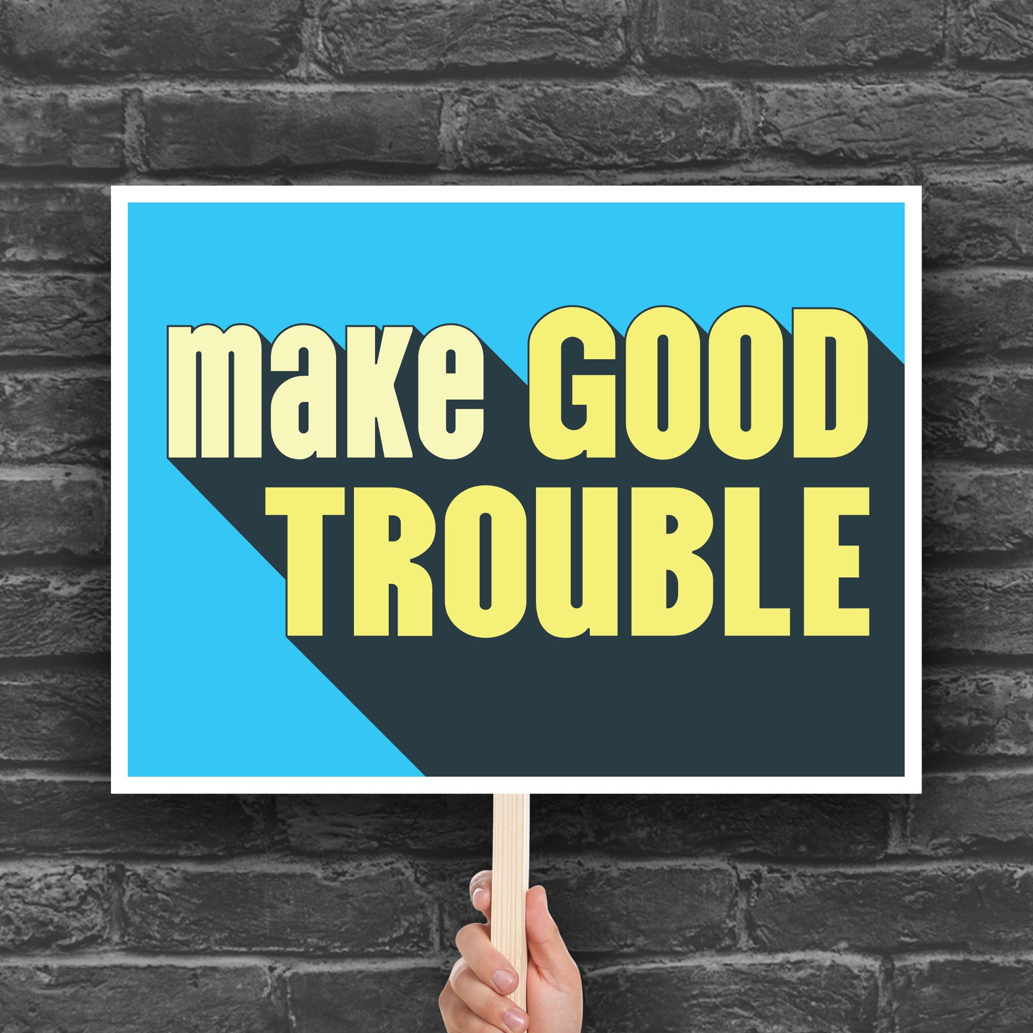 Downloadable, printable protest sign with bold text reading "Make Good Trouble" – a tribute to John Lewis’ legacy and a call for courageous, principled resistance against injustice.
