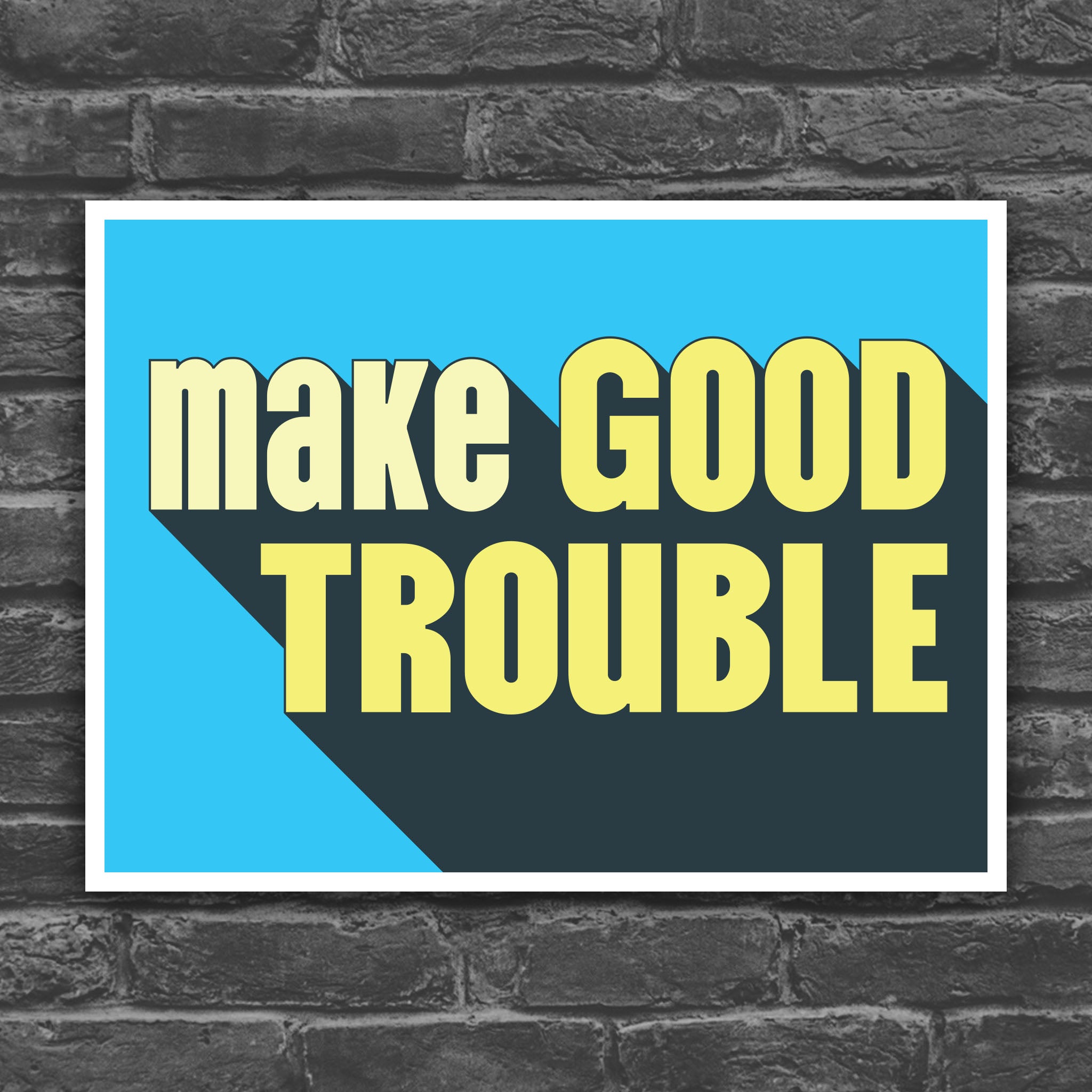 Color version of protest sign with bold text reading "Make Good Trouble" – a tribute to John Lewis’ legacy and a call for courageous, principled resistance against injustice.