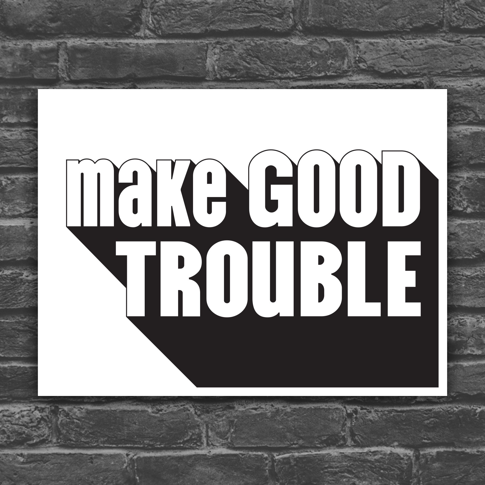Black and white version of protest sign with bold text reading "Make Good Trouble" – a tribute to John Lewis’ legacy and a call for courageous, principled resistance against injustice.