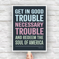 Protest sign with a dark background featuring the quote "Get in Good Trouble, Necessary Trouble, and Redeem the Soul of America" in large, bold, colorful text. The quote is attributed to John Lewis.