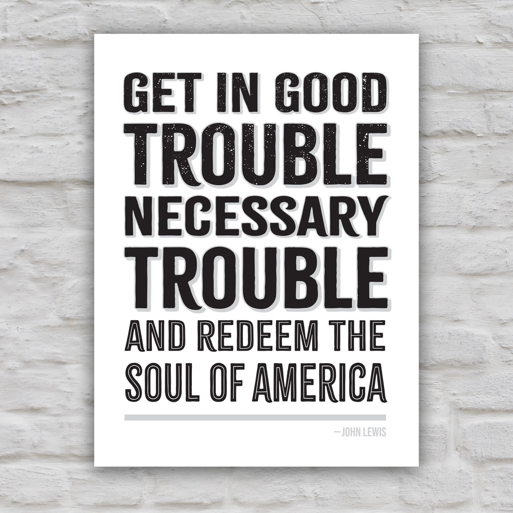 Black and white version of protest sign with a dark background featuring the quote "Get in Good Trouble, Necessary Trouble, and Redeem the Soul of America" in large, bold, colorful text. The quote is attributed to John Lewis.