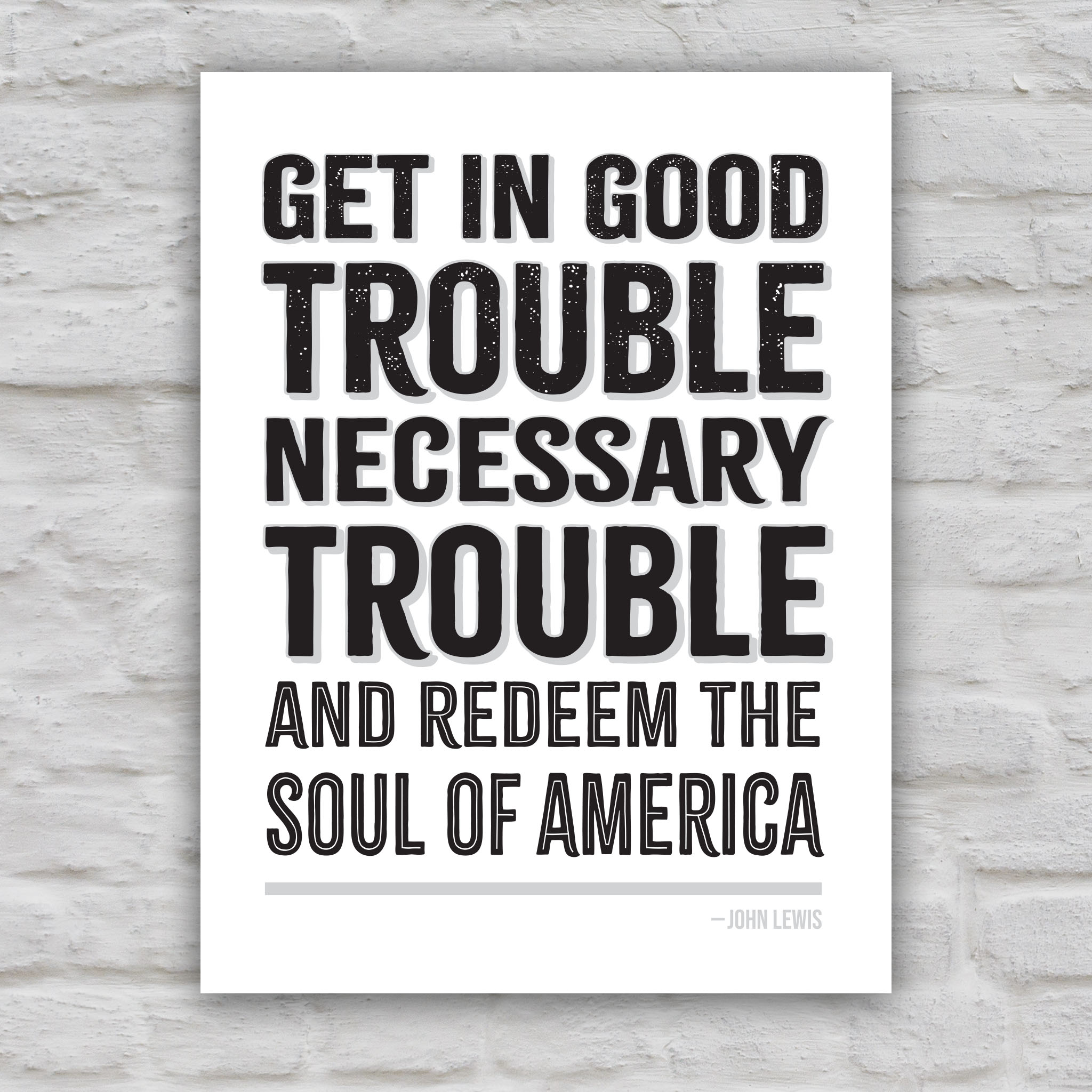 Black and white version of protest sign with a dark background featuring the quote "Get in Good Trouble, Necessary Trouble, and Redeem the Soul of America" in large, bold, colorful text. The quote is attributed to John Lewis.