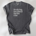 Pepper t-shirt with a stylized text block reading “the only thing more powerful than hate is love." 