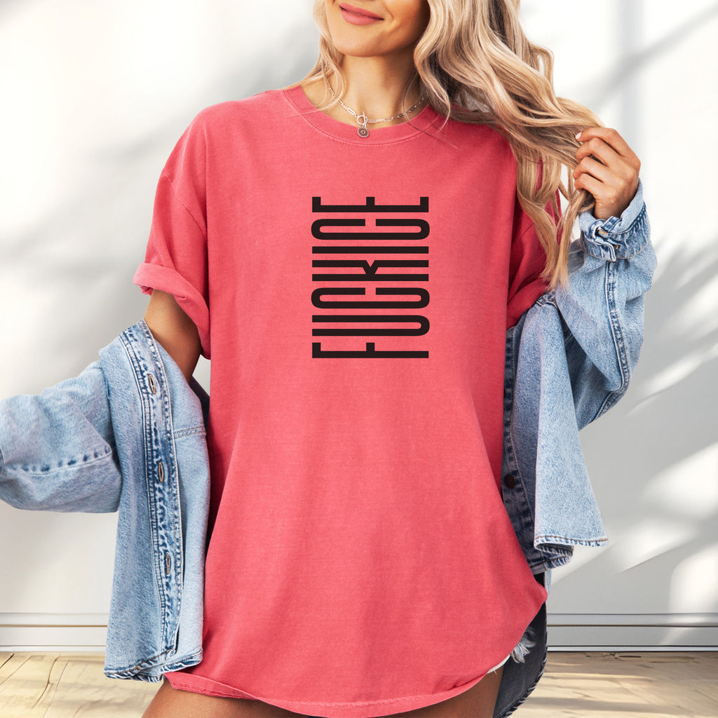 Female model wearing oversized watermelon t-shirt with minimalist black geometric design that subtly spells “Fuck ICE” using stacked bars and negative space, hidden protest message shirt.