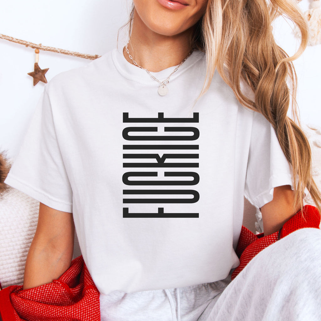 Female model wearing white t-shirt with minimalist black geometric design that subtly spells “Fuck ICE” using stacked bars and negative space, hidden protest message shirt.