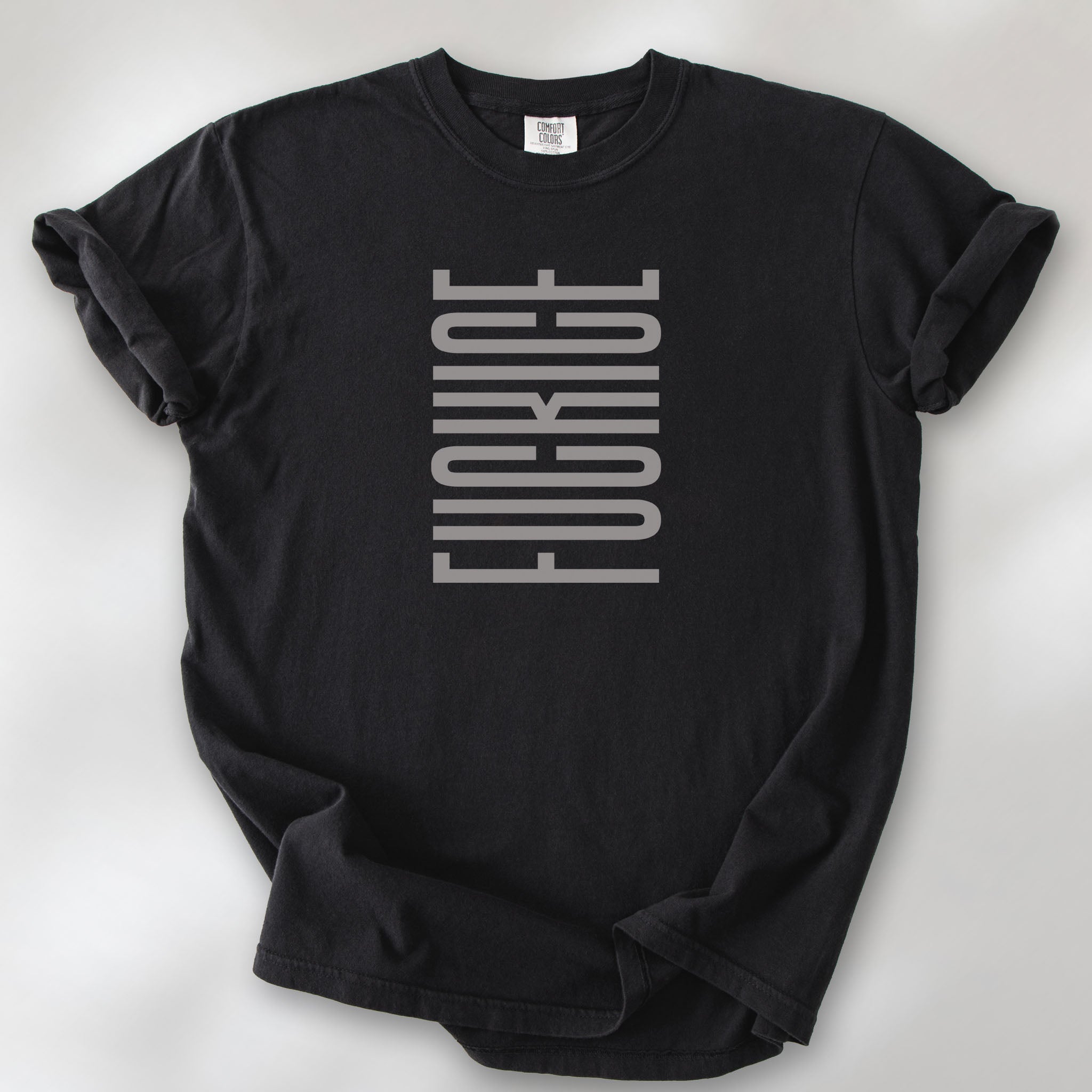 Black t-shirt with minimalist geometric design that subtly spells “Fuck ICE” using stacked bars and negative space, hidden protest message shirt.