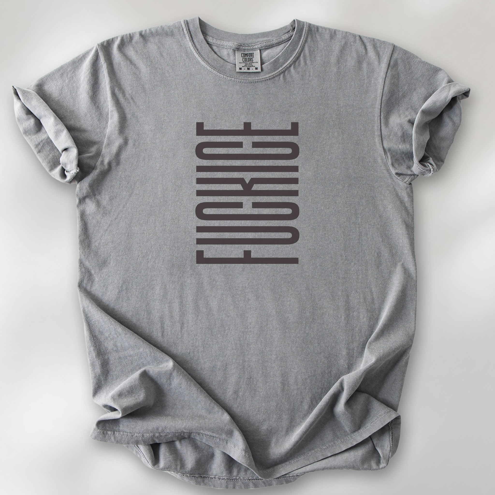 Grey t-shirt with minimalist geometric design that subtly spells “Fuck ICE” using stacked bars and negative space, hidden protest message shirt.