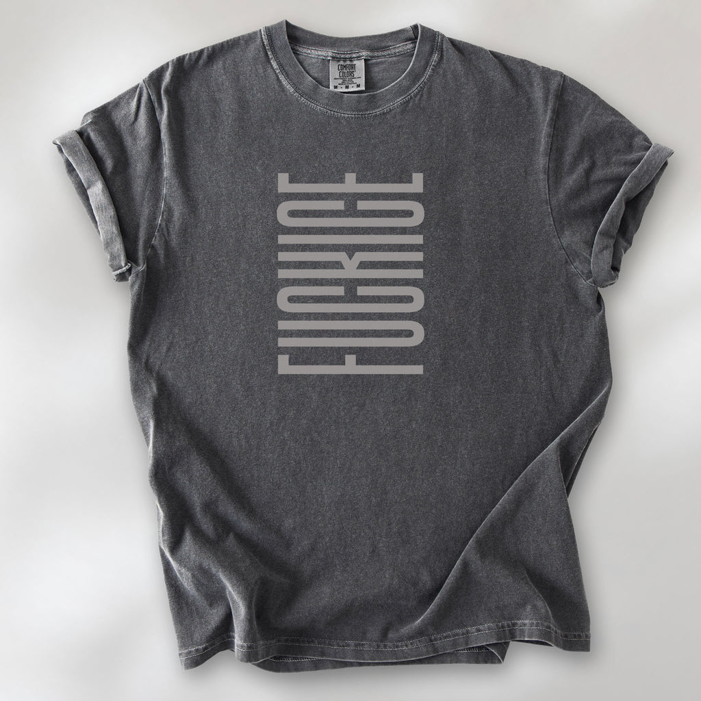 Pepper t-shirt with minimalist geometric design that subtly spells “Fuck ICE” using stacked bars and negative space, hidden protest message shirt.